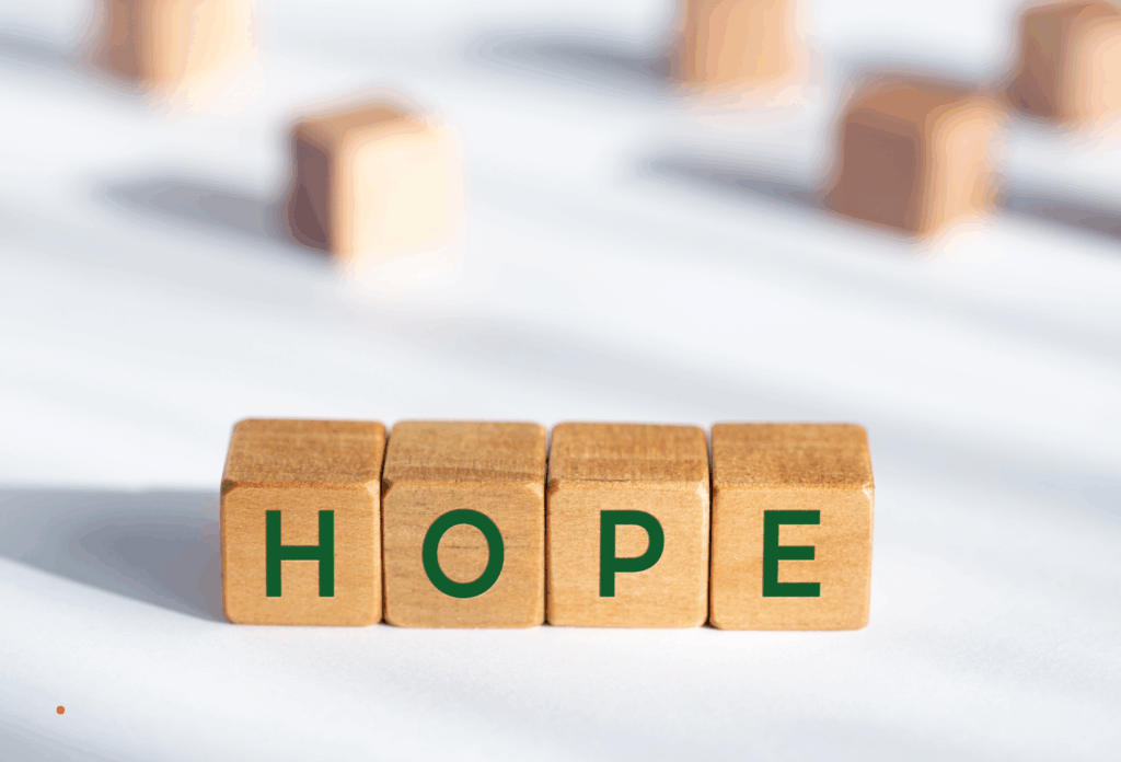 wooden blocks spelling “hope” representing healing and resilience