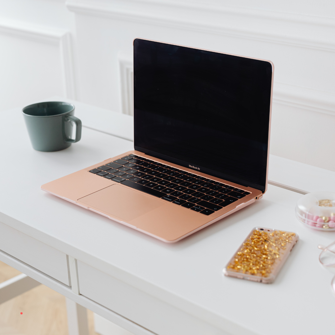 minimal desk with laptop prepared for quiet writing time