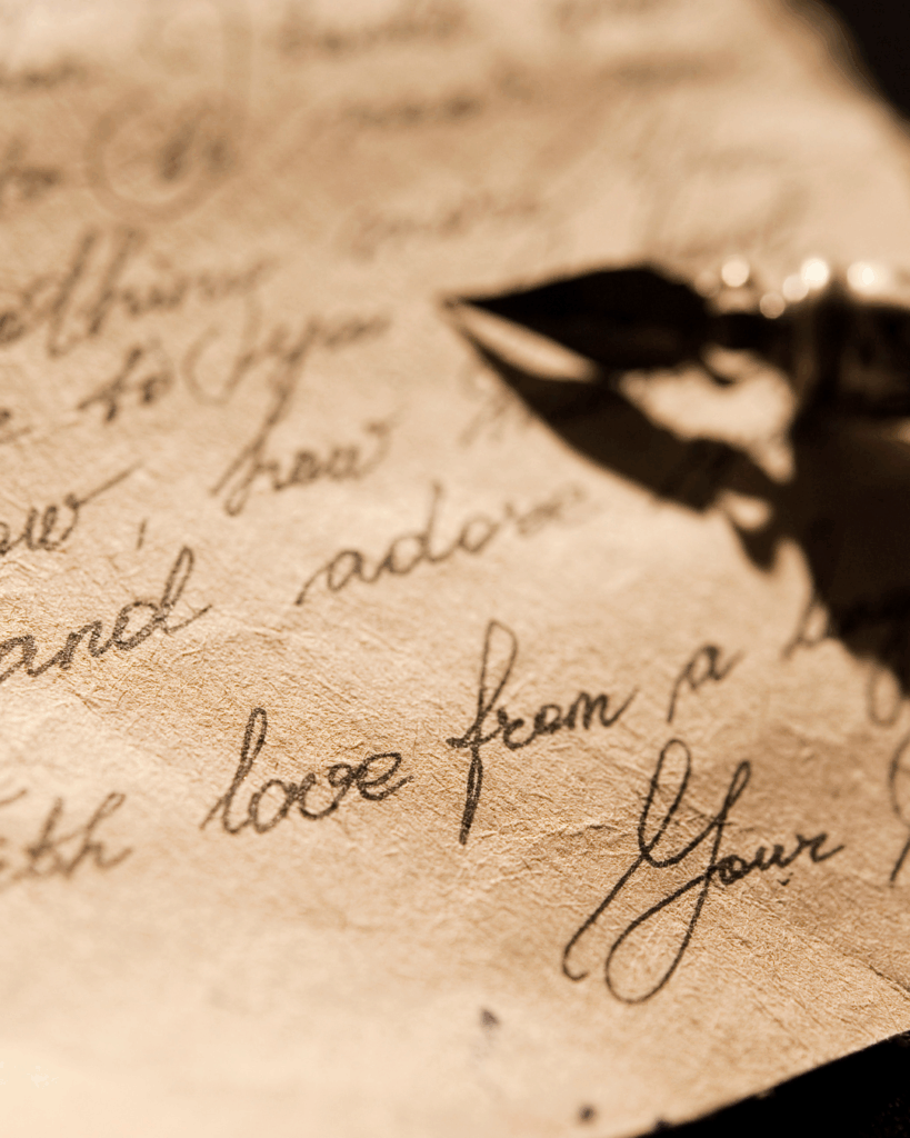 Close-up of a fountain pen resting on handwritten letter, symbolizing introspection, memory, and personal storytelling.