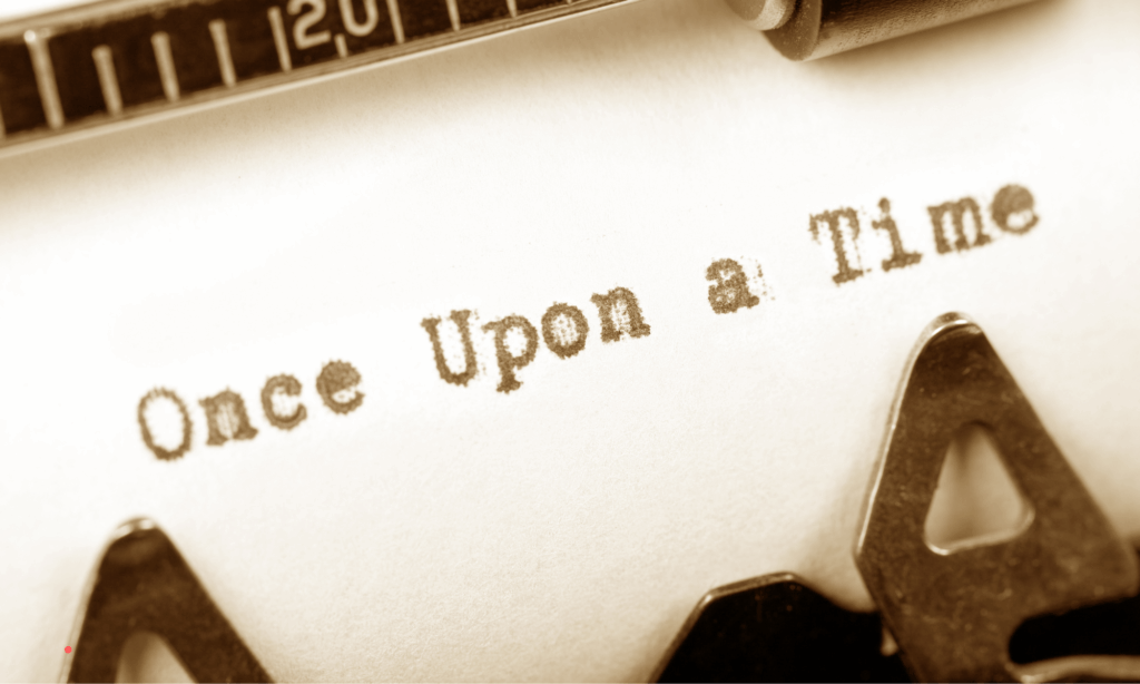 Close-up of a typewriter with the words “Once upon a time,” symbolizing storytelling as a tool for emotional healing