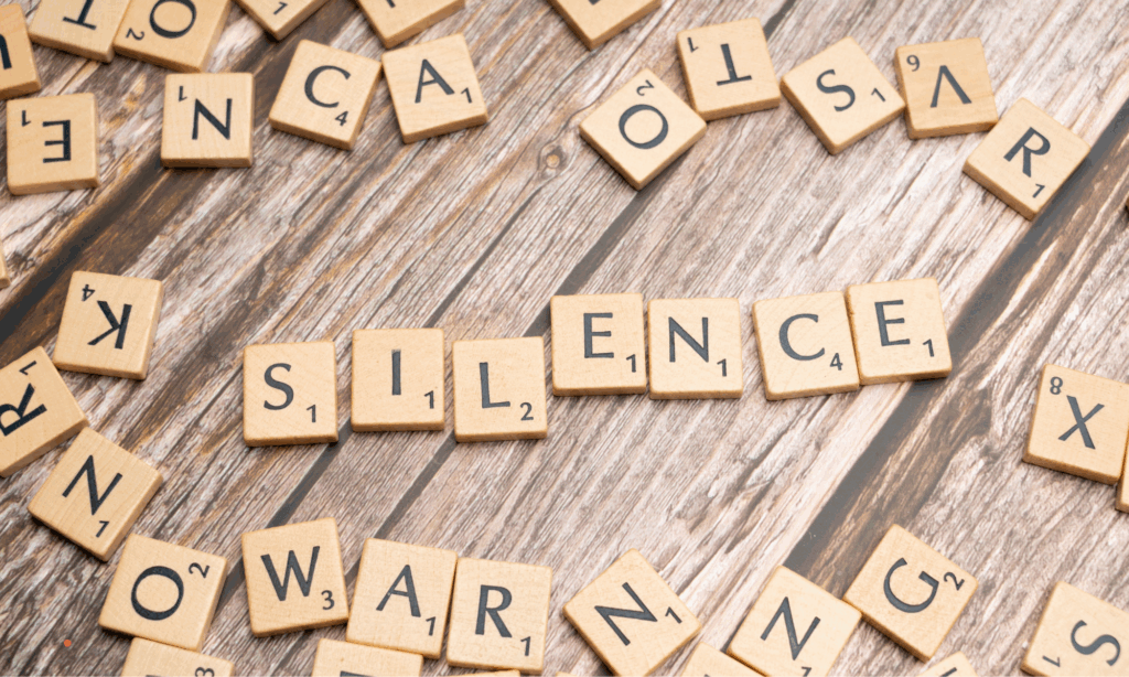 The word “silence” symbolizing inner reflection and quiet awareness.