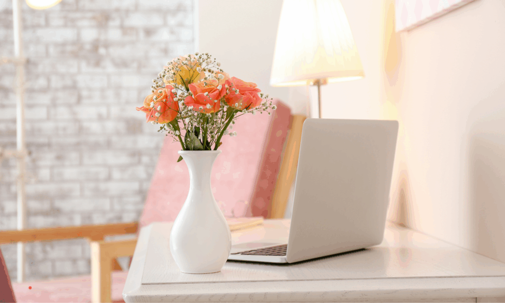 relaxing journaling scene with flowers and laptop
