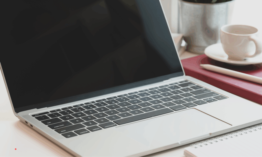 ghostwriting process writing on laptop with notes