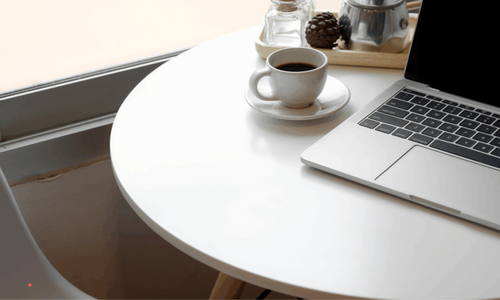 simple journaling workspace with laptop and coffee for daily writing habit