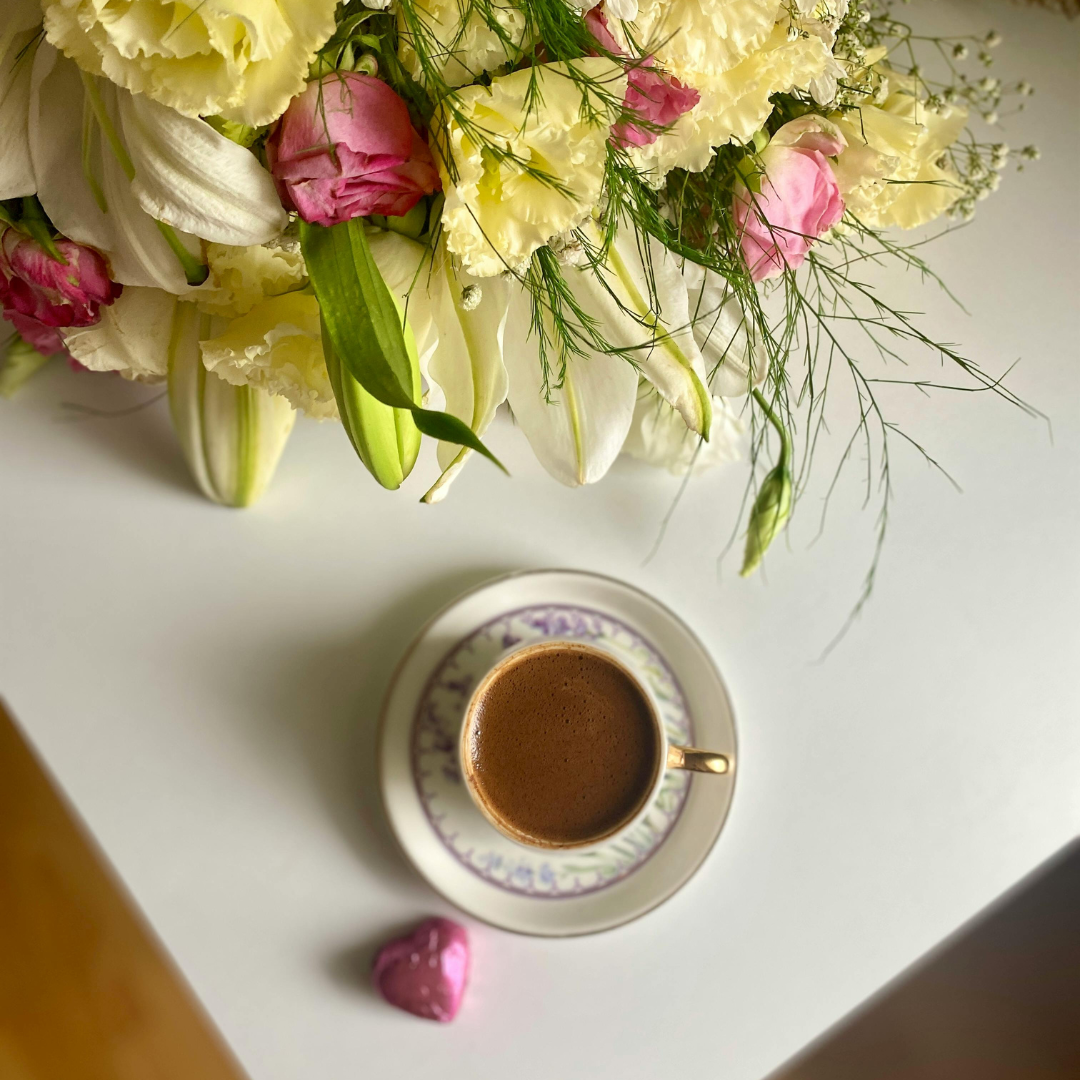peaceful writing environment with flowers and laptop for journaling practice