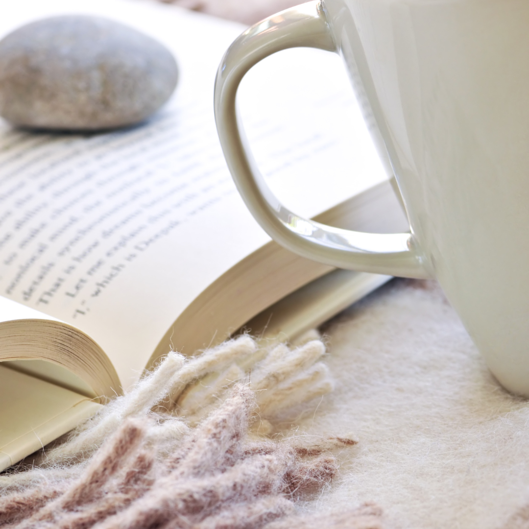 relaxing journaling scene with coffee and book for slow reflective writing
